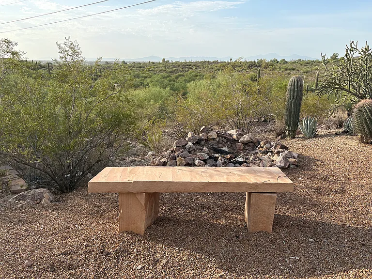 Fire pit with views of conservation area and city lights.