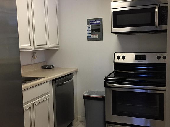 Full kitchen with extra large side by side refrigerator with