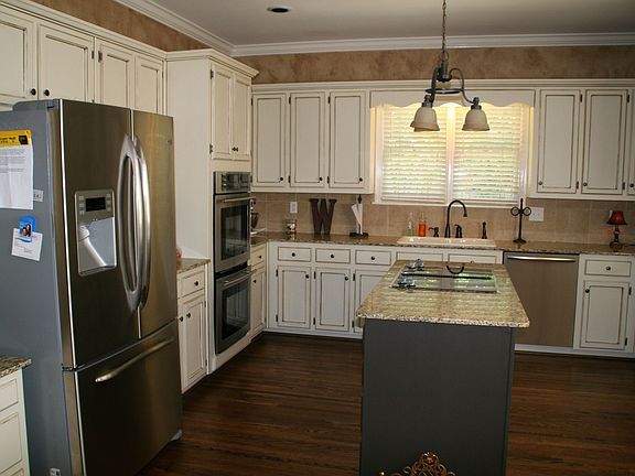 Repainted kitchen and faux finished cabinets.