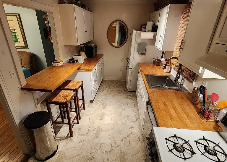 New kitchen with real butcher-block tops, dish washer, and gas cooking.