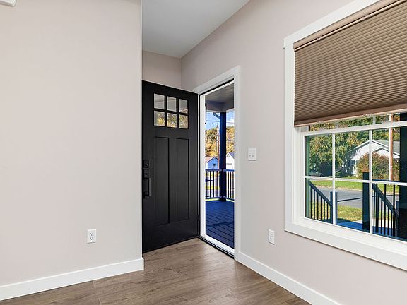 Front entry. Coat closet, unseen in the photos, is across from the door.
