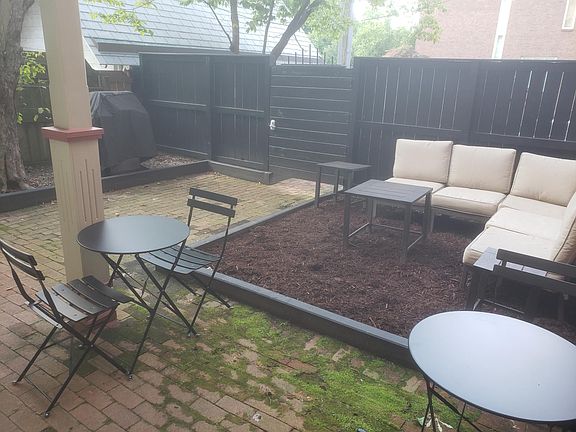 Grill and Seating Area in Shared Back Yard