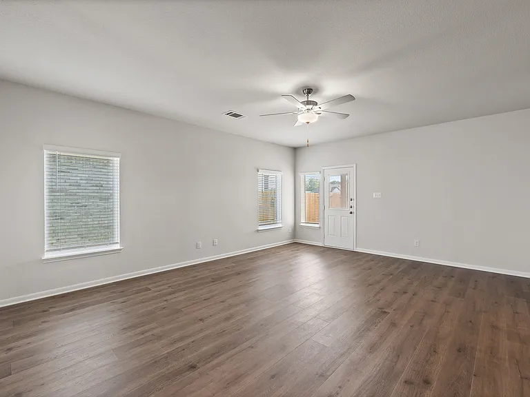 The open family room has large windows that let in great, natural light.