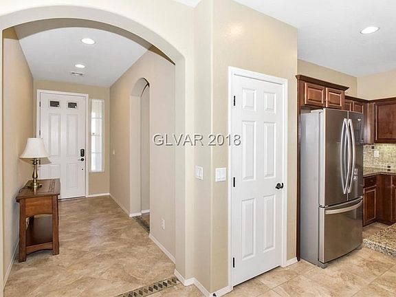 Entry hallway with tile floor.