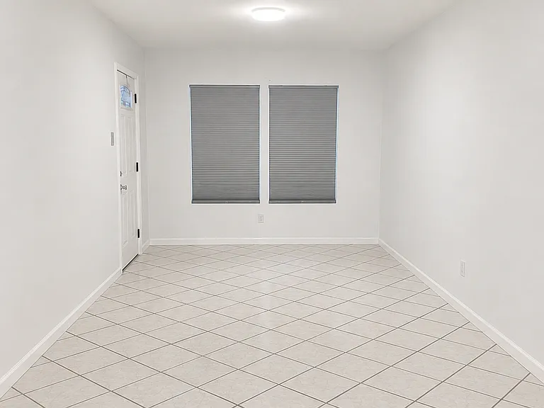 Extra storage area for playroom, office or home gym. Side door provides access