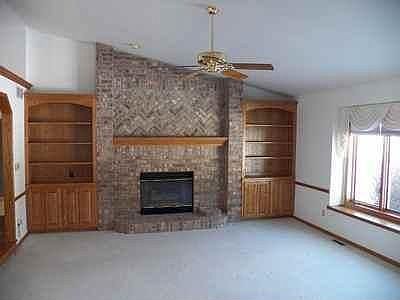 Gorgeous floor to ceiling brick fireplace with gas log
