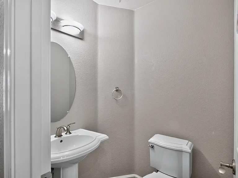 Powder bath located off entryway.