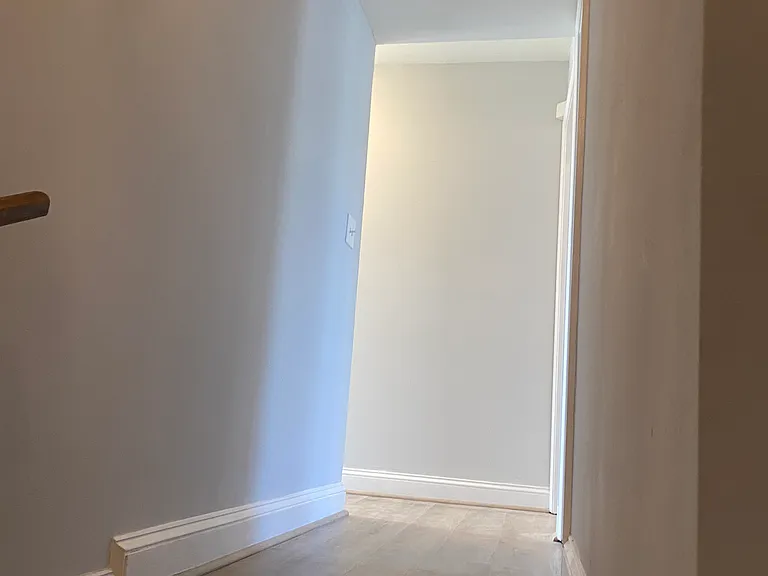 hallway from the stairs; bedrooms on the right