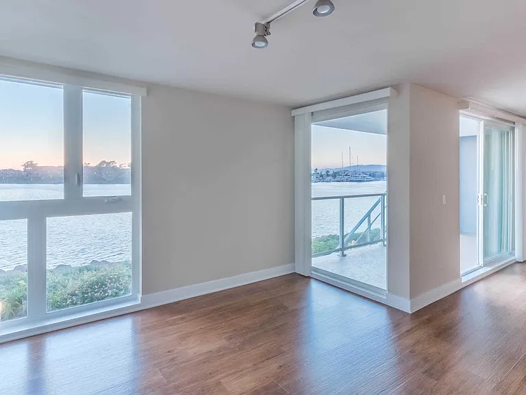 Living Room with Balcony and Floor-to-Ceiling Windows