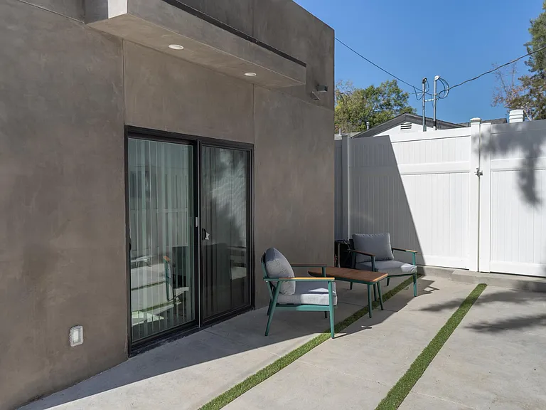 PRIVATE FENCED PATIO WITH OUTDOOR SEATING/FURNITURE