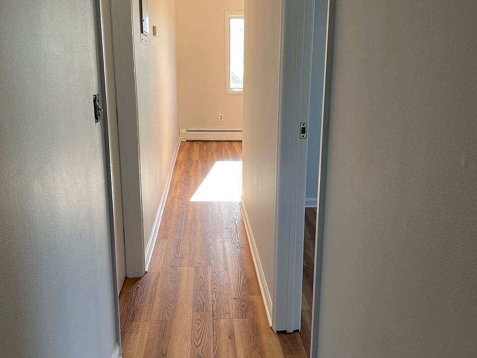 Hallway leading from kitchen to LR. Bedroom on the right.