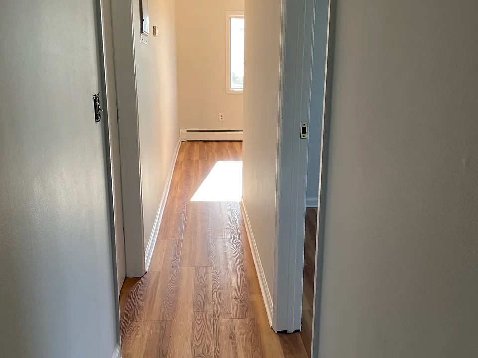 Hallway leading from kitchen to LR. Bedroom on the right.