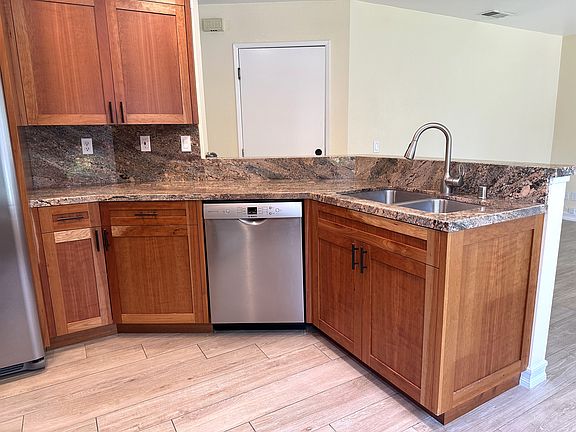 Bosch dishwasher, double stainless steel sink, granite counter top