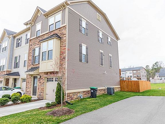 Front of house. End unit with fully fenced back yard