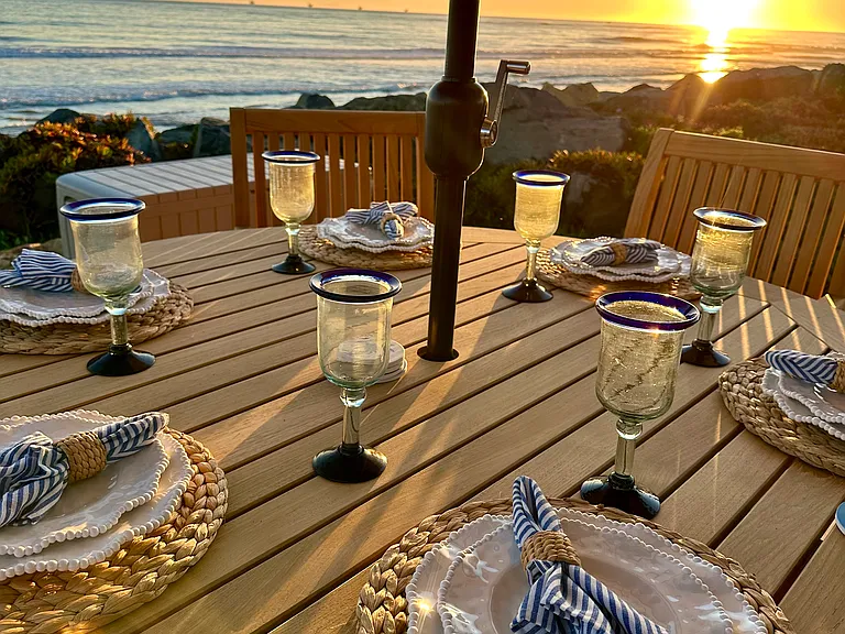 Sunset dining at the 6 seating table on the oceanfront deck.