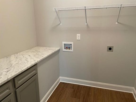 Full laundry room with folding area