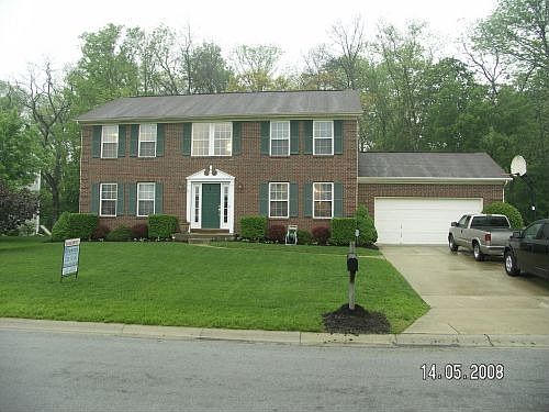 Front of house, street view; looking West