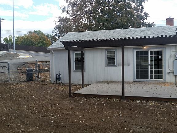 Fenced back yard, deck with pergola underground sprinklers