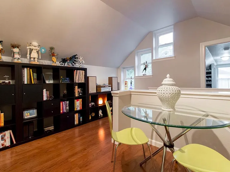 living/study/office upstairs off primary bedroom, background: additional storage/closet