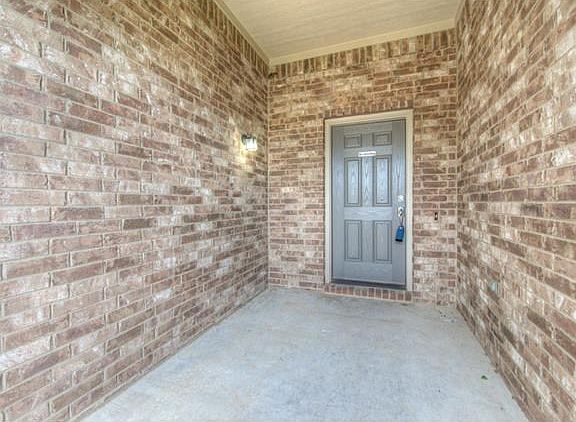 Brick entry invites guests inside.