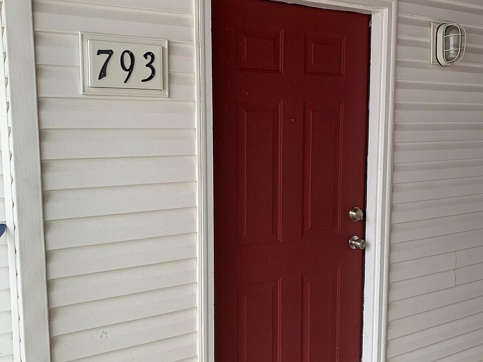 Covered front door. Lower level apartment.