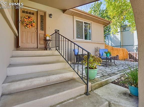 Custom stone patio just off entrance.