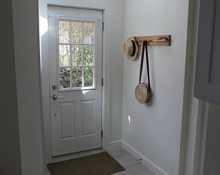 Primary entry with closet on left and skylight.