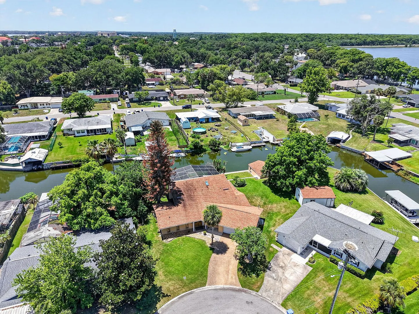 Available Now! Unique Canal-Front Pool Home with Boathouse & Chain of Lakes Access — Photo 3