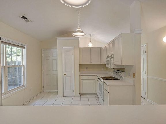 Laundry room to the left 