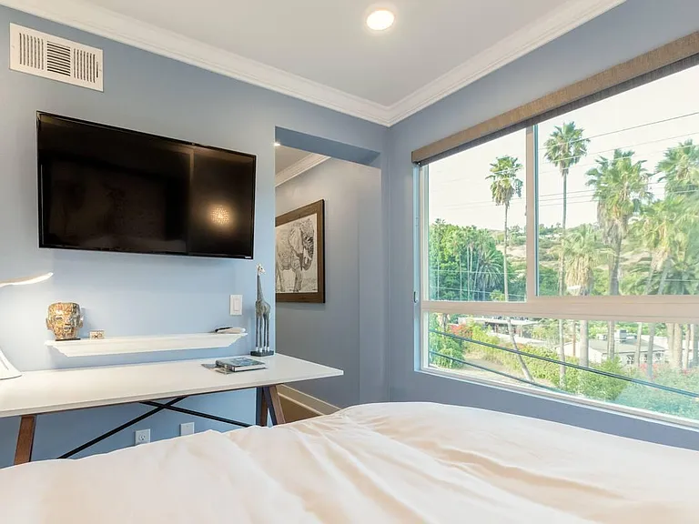 This is the wall bed fully lowered. The most comfortable and luxurious duvets highlight this queen-sized unbelievably comfortable tempurpedic mattress.