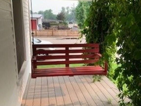 covered front porch with swing