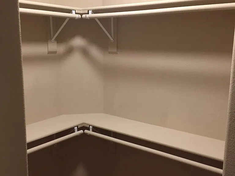 Walk-in closet in 1st master bedroom