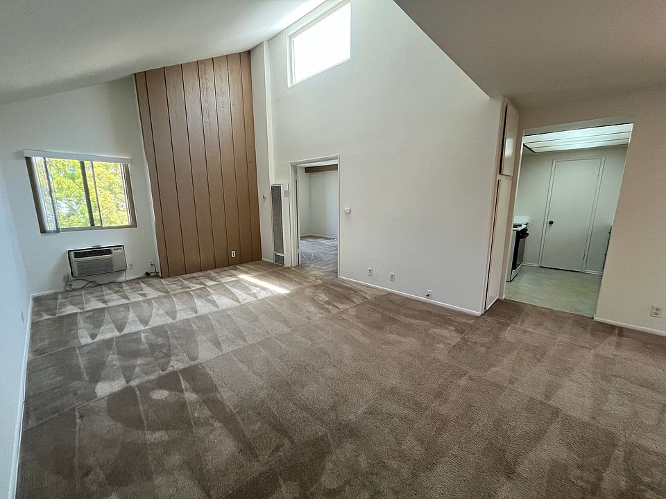 At entrance. looking at living room & into kitchen