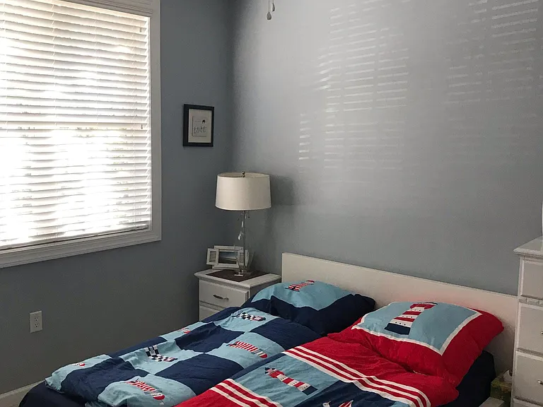 Additional bedroom shown with queen size bed