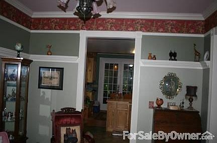 Parlor
						:
						Bay window on the front. Victorian wallpaper, beautiful paint and trim.