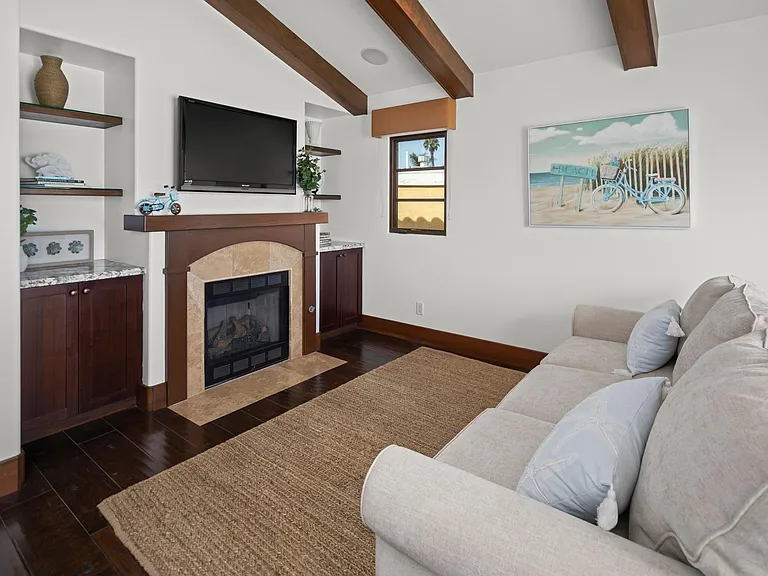 Upstairs TV room with couch sofa bed and balcony, fireplace, TV