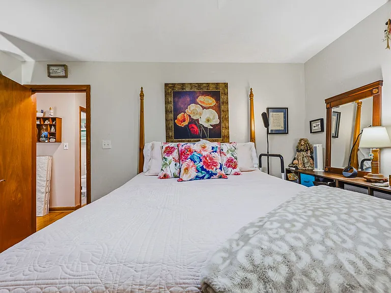 MAIN LEVEL: Back Bedroom (Hall ahead on right, closet to left)