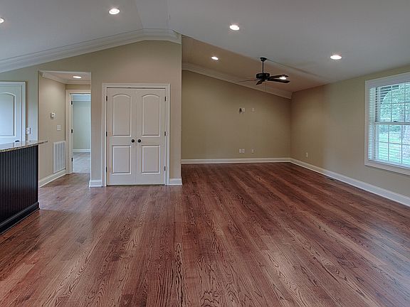 Vaulted great room with hardwood floors