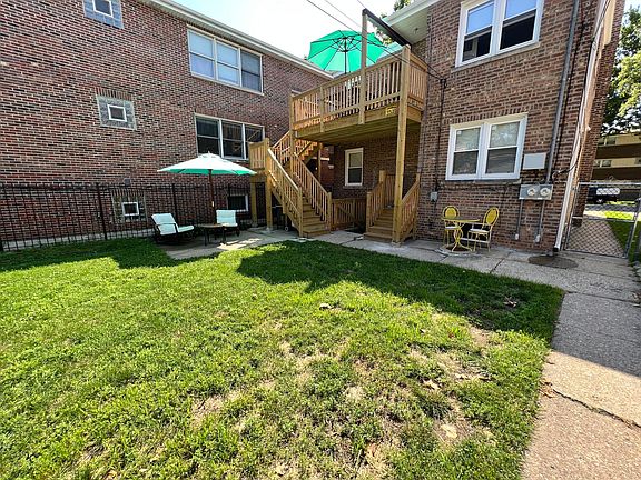 Large fenced in yard with a patio