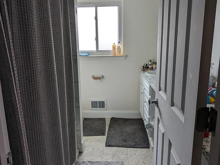 Upstairs full bathroom with double vanity