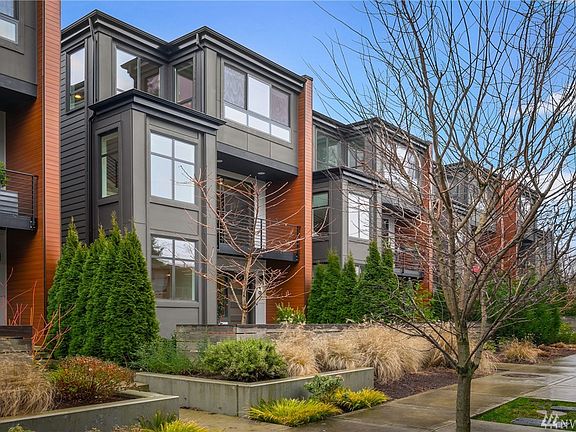 Tucked away on a dead end street and professionally landscaped, this limited offering of West facing units is a unique collection of NW modern style.