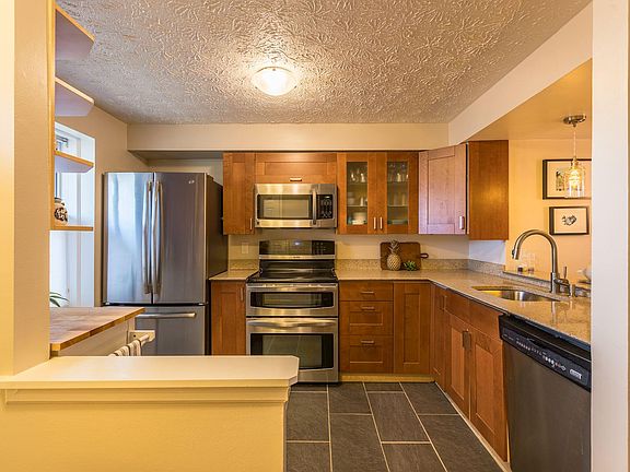 UPDATED KITCHEN WITH STAINLESS STEEL APPLIANCES