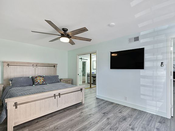 Master Bedroom has a California King Size bed. There is a private bathroom and bathtub , as well a an office and wardrobe closet