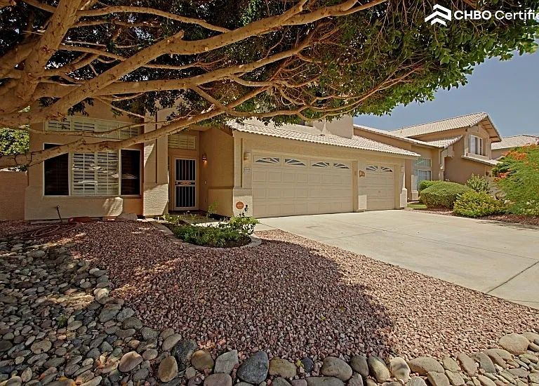 Impeccable landscaping of rock beds, flowerin