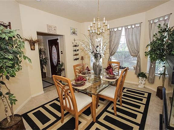 Spacious Formal Dining With Wall of Windows