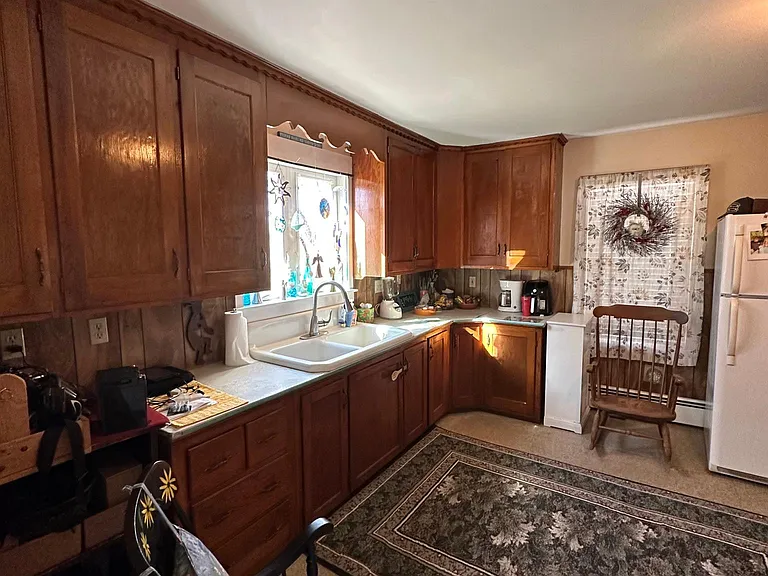 View of the kitchen while the current tenant is occupied. Furnishings not included.