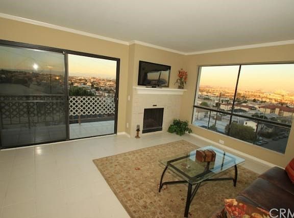 Close-up of living room with pretty fireplace and views galore!!!