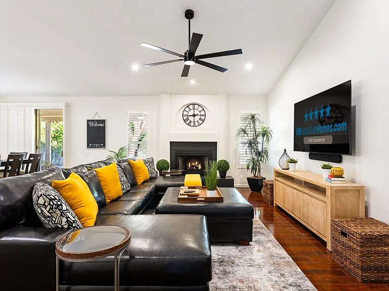 Family Room with Fire Place and 75" Smart TV