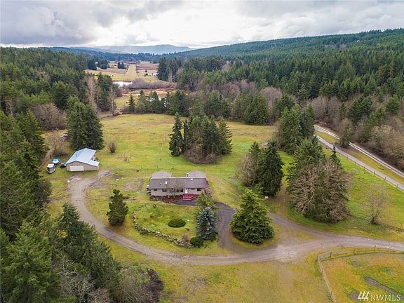Aerial from the north can't see the barns in this view.  Yet you can see how the house is facing south and it has a large deck for those lazy afternoons in the Sun, BBQ's, and viewing the land.