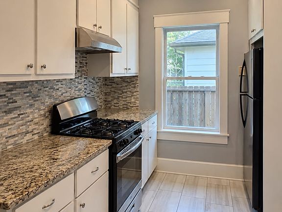 The kitchen is bright and functional. It has been recently painted and refreshed while maintaining a simple, classic feel that complements the character of this bungalow. A recently renovated window brings in plenty of natural light.